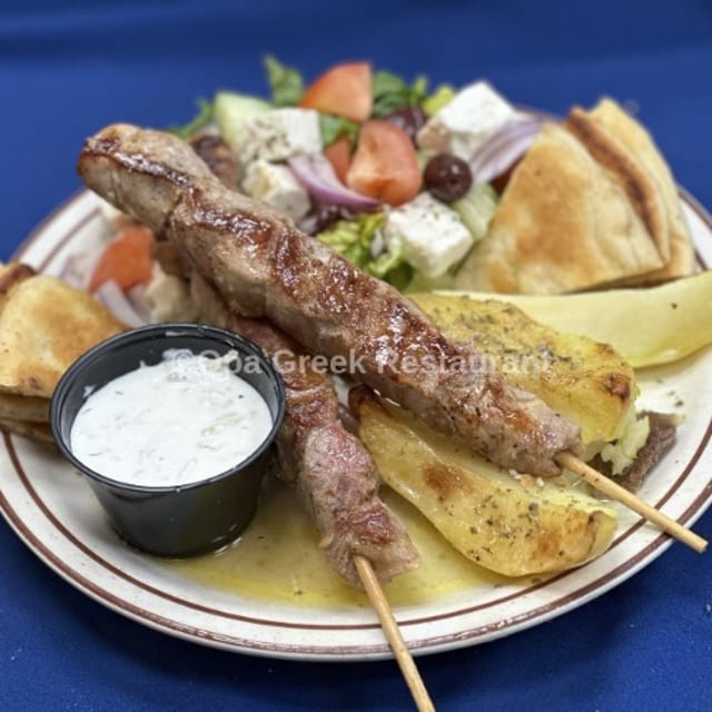 Pork Souvlaki (2 skewers) Platter Greek Salad, Pita Bread, Tzatziki Sauce, Choice Of Lemon Potatoes Or Rice Or Fries.